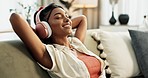 Woman, home with headphones and music, happy to relax on sofa with entertainment and peace. Energy, hip hop and listen to radio, audio streaming and wellness with break in lounge, tech and having fun