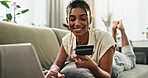 Woman, credit card and laptop on sofa with cybersecurity check, fintech app and banking info in home. Girl, computer and easy payment with customer experience, budget or sales on e commerce website