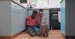 Phone, floor and couple in kitchen for conversation, bonding and healthy relationship in home. Dating, love and black man and woman sitting on smartphone for social media, internet and online website