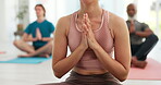 Hands, yoga and meditation for balance with a person on the floor of a gym for wellness, mental health or zen. Fitness, exercise and peace with a yogi training in a class for mindfulness closeup