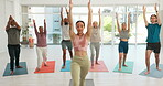 Yoga, men and women in studio with stretching, exercise or workout for wellness and fitness with peace. Pilates, people or group with training, gym and instructor with meditation, zen and freedom