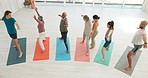 Yoga, top view or people stretching in class for wellness, peace or balance with group in studio. Coach, mature or calm instructor teaching pilates pose for chakra energy, health or holistic healing