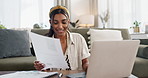 Woman, documents and computer for home budget, online financial research and planning bills, taxes or investment. Young worker or freelancer typing on laptop with house paperwork or loan application
