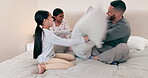 Father, bed or pillow fight with children for love in laughter, weekend together or support with care. Mexican, happy family or dad with girl kids on bed with playing games to relax or quality time
 