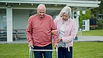 Walker, senior couple and walking outdoor with support and help with retirement and marriage. Wellness, guide and elderly woman and man together with love and care with mobility issue after surgery