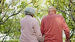 Senior couple, fruit tree and walking back with support and smile from nature with love and care. Countryside, freedom and wellness with happy woman and man together in retirement and green forest