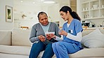 Advice, old woman and nurse on couch with pills, help and homecare in living room together. Retirement, healthcare and elderly person with caregiver, medical talk and senior care on sofa together.