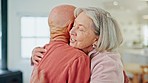 Senior couple, hug and home with happy love, support and care together in retirement with marriage. Lounge, smile and relax with a woman and calm man together with rest in a living room with embrace