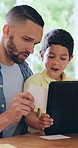 Education, tablet and father with boy child in a house with paper, note or memory development. Family, love and kid with parent on digital app for learning, games or homeschool lesson in their home