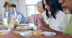 Family, food and pray grace at table, faith and gratitude in worship, spiritual and christian. People, hands and together to eat, religion and love for God, home and trust or hope in dining room