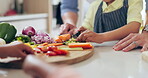 Hands, cutting and vegetables for food in kitchen with help, support and learning or development in home. People, children and preparing, cooking and healthy dinner for nutrition or health with knife