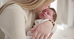 Family, kiss and a mom rocking her baby to sleep in the bedroom of their home together for love or care. Dreaming, nap or tired with a mama and newborn infant in an apartment to rest for growth