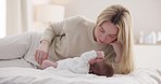 Children, love and a mother on the bed with her baby for sleep, rest or bonding together in a home. Family, bedroom and a woman in an apartment with her newborn infant to relax for care or growth