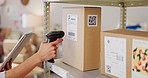 Hand, scanner and box with barcode in warehouse with tablet, inventory app or check stock on shelf. Workshop person, cardboard package and QR code with touchscreen for shipping, supply chain and info