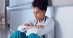 Doctor, stress and sad on floor for hospital mistake, healthcare fail or bad news of clinic death. Mental health of medical worker, tired woman or nurse with depression, anxiety or fatigue for crisis