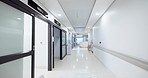 Hospital, empty hallway and gurney pov or medicare at clinic, medical and care in corridor. Medicine, wellness and treatment for illness, support and trust in emergency, lobby and service for injury 