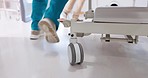 Group, doctor and legs running with bed for emergency, ICU or quick surgery to save a life at hospital. Closeup of medical people or shoes in rush with stretcher for healthcare, urgency or support