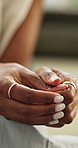 Anxiety, zoom and hands of woman with fear, stress or trauma, abuse or insecure at home. Nervous, closeup and lady person overthinking, worry or or mental health crisis in a living room with conflict