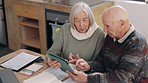 Tablet, conversation and senior couple in dining room for mortgage, finance bills or payment. Digital technology, discussion and elderly man and woman in retirement talk for pension budget at home.