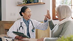Doctor, woman and high five for healthcare, tablet and advice or communication at home. Elderly person, medical professional and tech for positive results, diagnosis and treatment in retirement