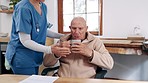 Woman, nurse and coffee in elderly care for service, trust or support at old age or retirement home. Female doctor or medical caregiver giving tea, mug or drink to senior or person with a disability