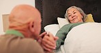Care, sick and senior couple in bed holding hands for support, bonding and empathy at home together. Retirement home, marriage and elderly man and woman in bedroom for illness, healing and recovery