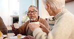 Tea party, friends and conversation with an old man in a retirement home together for bonding in the morning. Food, drink and a group of senior people talking in the living room of an apartment