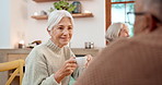 Tea party, conversation and friends with an old woman listening in a retirement home for bonding in the morning. Smile, drink and group of happy seniors chatting together in an apartment living room