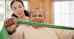 Old woman, nurse and resistance band exercise for arm mobility, retirement strength or rehabilitation. Senior person, caregiver and trust for physical therapy or recovery, stretching or flexibility