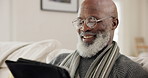 Old man, tablet and laughing in home for entertainment, internet connection or conversation. Black male person, smile and touch screen for social media or streaming app, online web or network reading