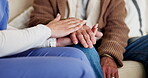 Hand, person or caregiver with holding hands for empathy, compassion and support for healthcare or retirement on sofa. People, nurse or professional and care or sympathy for consulting or counseling