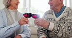 Love, cheers and elderly couple with wine in the living room for bonding together at modern house. Happy, smile and senior man and woman in retirement drinking alcohol on a sofa in the lounge at home