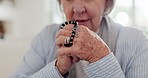 Woman, hands and praying with crucifix, faith and worship or spirituality for soul, support and belief. Senior person, confession and hope for forgiveness from god, gratitude and trust in religion