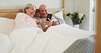 Phone, relax and senior couple in a bed with social media, meme or reading at home together. Smartphone, search and old people in a bedroom with app for online shopping, streaming or sign up service