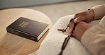 Rosary, hands of person or bible study for faith, studying religion or help in holy spiritual scripture. Christian literature, closeup or story for education or knowledge on God or Jesus Christ 