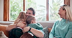 Smile, love and children hugging parents on sofa in the living room of modern family home. Happy, bonding and excited young kids embracing mother and father with care in the lounge together at house