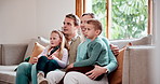 Happy family, relax and watching tv on sofa in living room for fun entertainment or bonding together at home. Mother, father and kids enjoying online streaming, movie or cartoons on couch at house