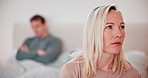 Woman, thinking and conflict of couple in bedroom with stress, breakup or toxic relationship at home. Face of frustrated partner in crisis, divorce and fight for cheating, affair or trauma of mistake