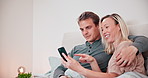 Couple, smartphone and smile in bedroom for social media, reading notification and scroll news app at home. Happy man, woman and pointing to cellphone, mobile contact and search for online shopping 