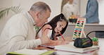 Grandfather, girl child and writing, home education or learning support for knowledge, development and math. Happy family, senior man and kid with homework, school test or quiz with guide or helping