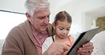 Grandfather, girl child and tablet for home education, e learning support and talking, reading or happy website games. Family, kid and senior man teaching on digital technology for school with ebook