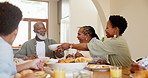 Happy, black family and kids in home at table for lunch, supper and eating meal at table together. Grandparents, parents and kids with food for bonding, relax and talking in dining room for health