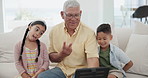 Grandfather, grandkids and selfie on tablet with peace sign, happiness and bonding on sofa in living room. Senior man, boy and girl child with photo memory on couch in lounge of home for relationship