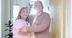 Senior couple, happy and smiling at door, marriage and embrace at home and retired. Retirement, elderly or love for commitment, bonding together or care for romantic relationship, man or woman
