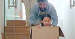 Happy family, moving in new home with box for real estate, property or investment and playing together. Excited father and child exploring house, apartment or renovation with boxes in relocation