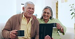 Senior, couple and coffee for tablet talking on home sofa for social media connection, laugh or internet reading. Man, woman and hot drink or digital touch screen or entertainment, retirement or bond