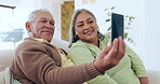 Video call, happy and senior couple on sofa with phone for chat, conversation and chatting online. Retirement, hello and mature man and woman wave for networking, connection and communication in home