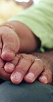 Hands, hope and a couple closeup in their home for love, empathy or comfort in time of loss, pain and grief. Help, trust or support with a man and woman praying for spiritual faith or healing