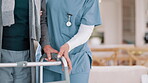 Nurse, physiotherapy and hands of woman on walker in recovery home, help and healthcare. Closeup of caregiver, senior person with a disability and walking frame, medical support and rehabilitation