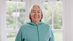 Happy, smile and face of senior woman by the window in the living room of modern retirement home. Positive, confident and portrait of elderly female person from Canada in the lounge of house.